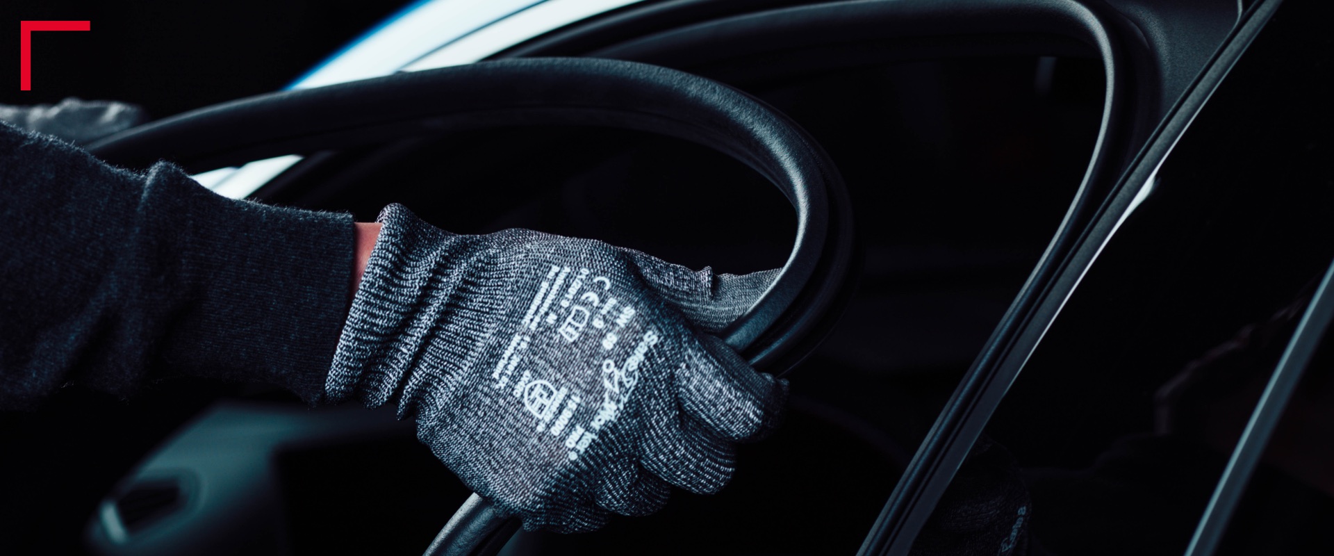 Hands with gloves adding sealing to a car