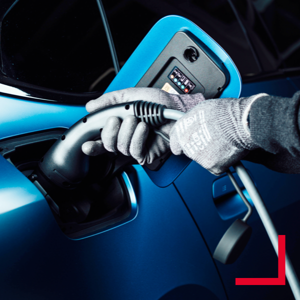 Blue car gets charged Image